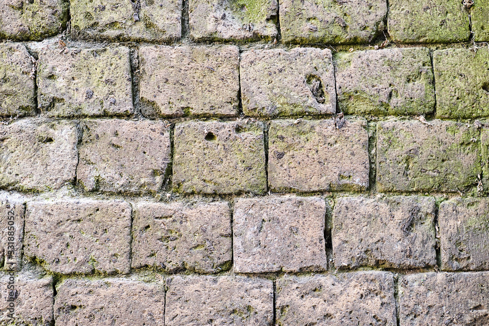 Background form a historic wall made of natural stones Background form a historic wall made of natural stones