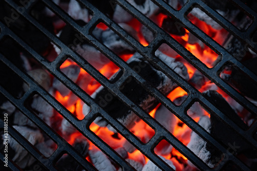 Red-hot coal. BBQ season. Close up of a grill hearth.