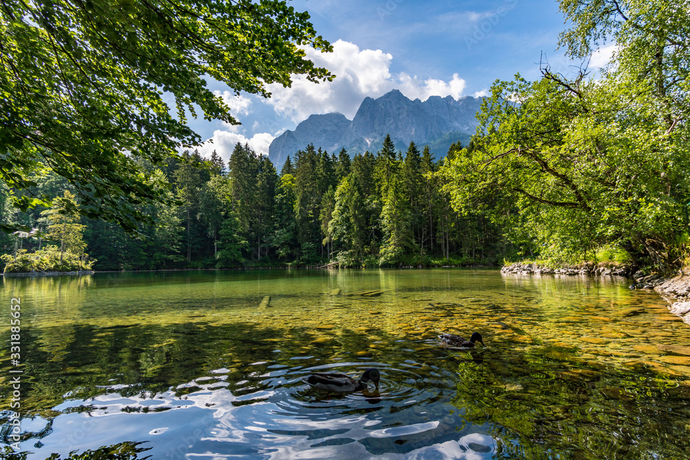 Fototapeta premium Fantastic round hike around the beautiful Eibsee at the Tiroler Zugspitze Arena