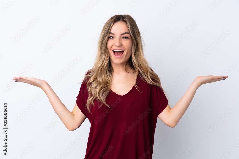 Young woman over isolated white background with shocked facial expression Young woman over isolated white background with shocked facial expression