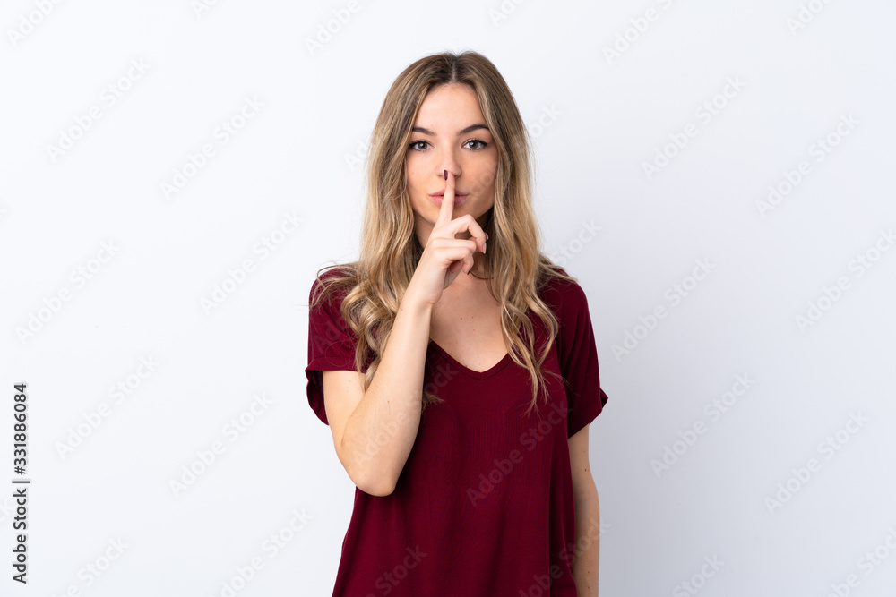 Young woman over isolated white background showing a sign of silence gesture putting finger in mouth Young woman over isolated white background showing a sign of silence gesture putting finger in mouth