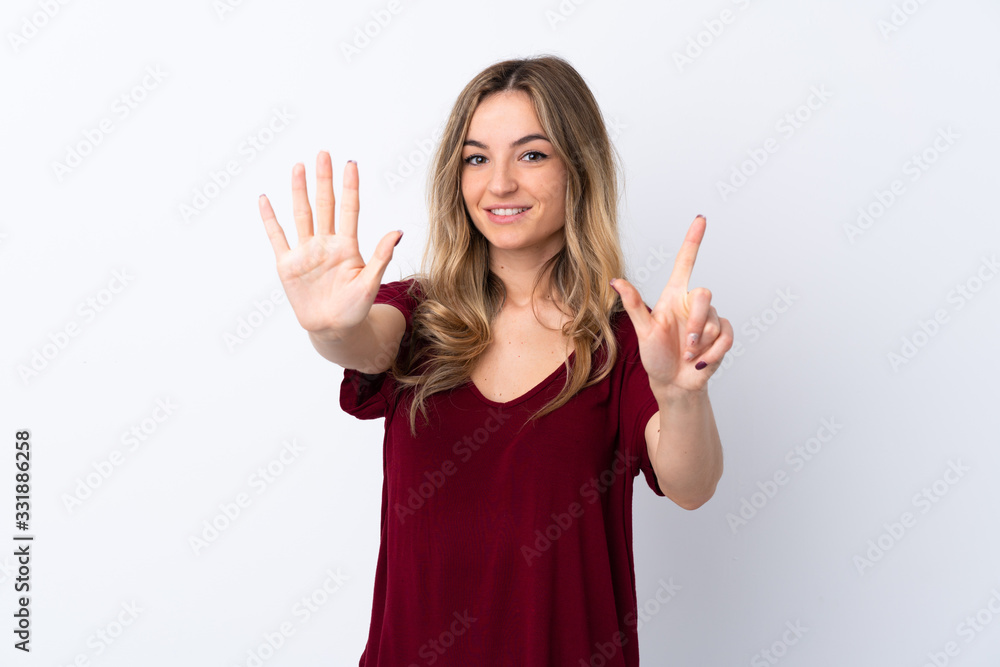 Young woman over isolated white background counting seven with fingers Young woman over isolated white background counting seven with fingers