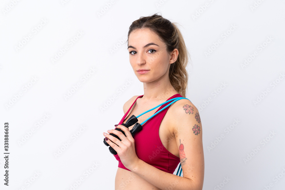 Young sport woman over isolated white background with jumping rope Young sport woman over isolated white background with jumping rope