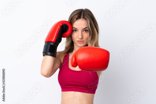 Young sport woman over isolated white background with boxing gloves