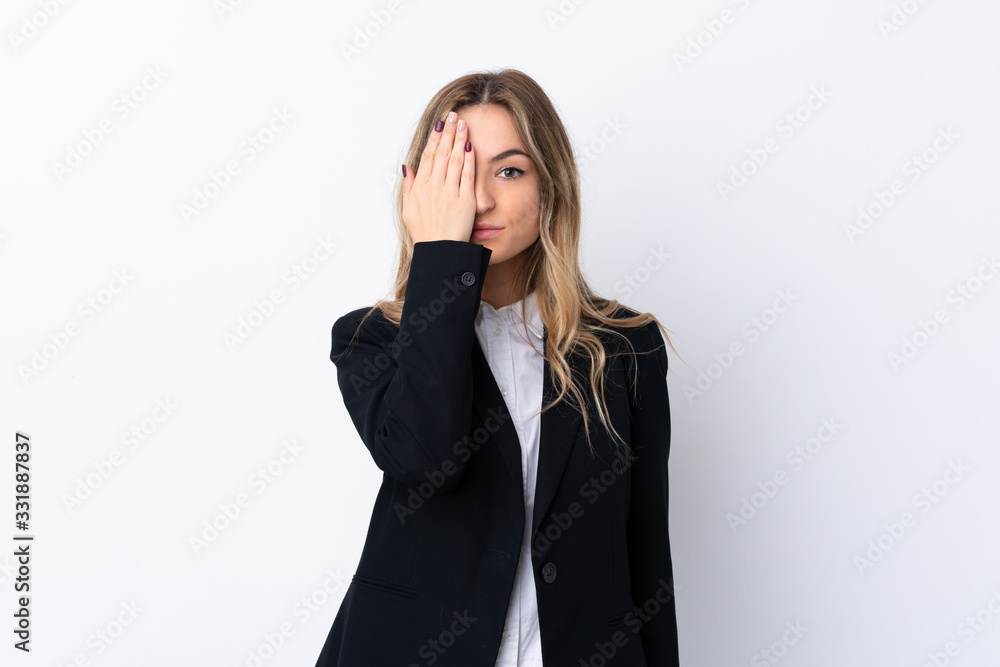 Young business woman over isolated white background covering a eye by hand Young business woman over isolated white background covering a eye by hand