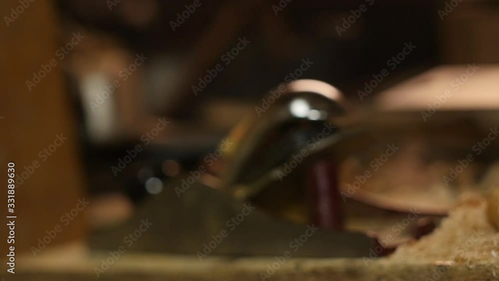Carpenter using spokeshave hand planer on wood woodworking Carpenter using spokeshave hand planer on wood woodworking