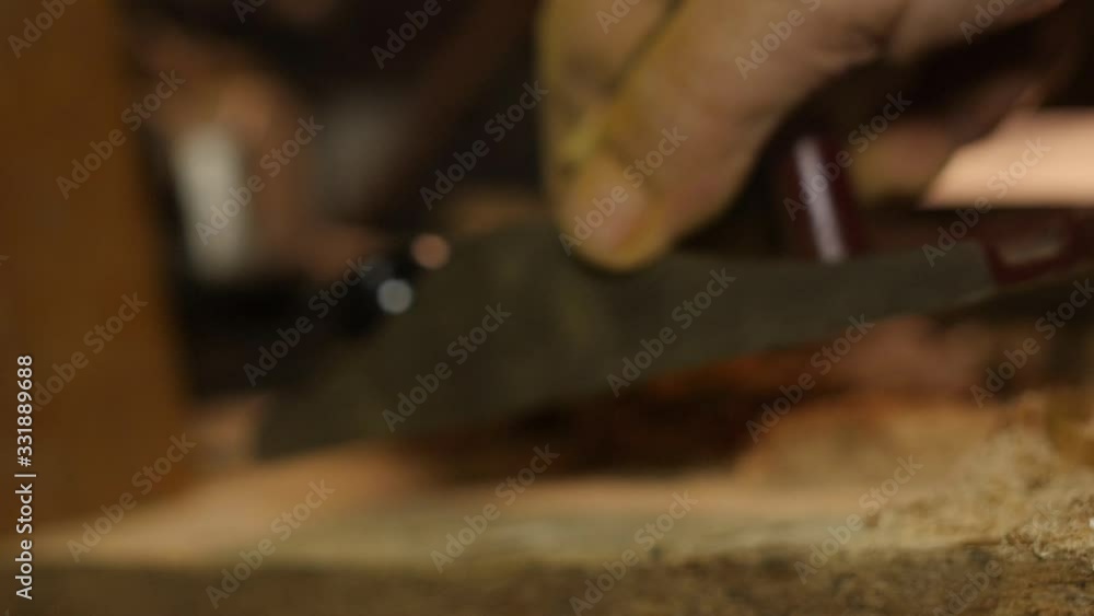 Carpenter using spokeshave hand planer on wood woodworking Carpenter using spokeshave hand planer on wood woodworking
