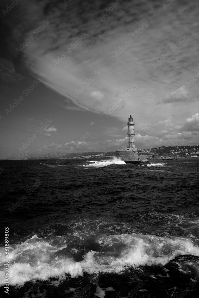 Lighthouse and turbulent sea