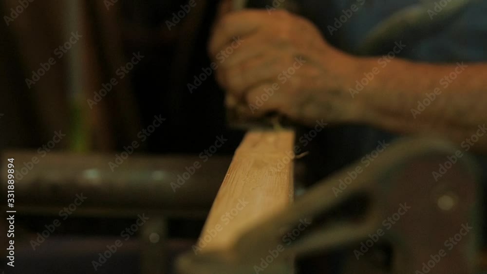 Carpenter using spokeshave hand planer on wood woodworking Carpenter using spokeshave hand planer on wood woodworking
