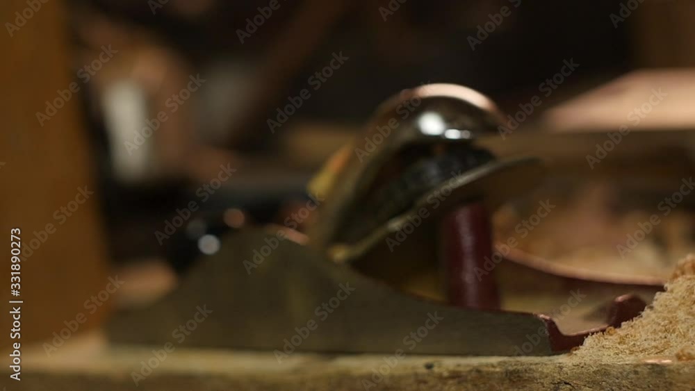 Carpenter using spokeshave hand planer on wood woodworking Carpenter using spokeshave hand planer on wood woodworking