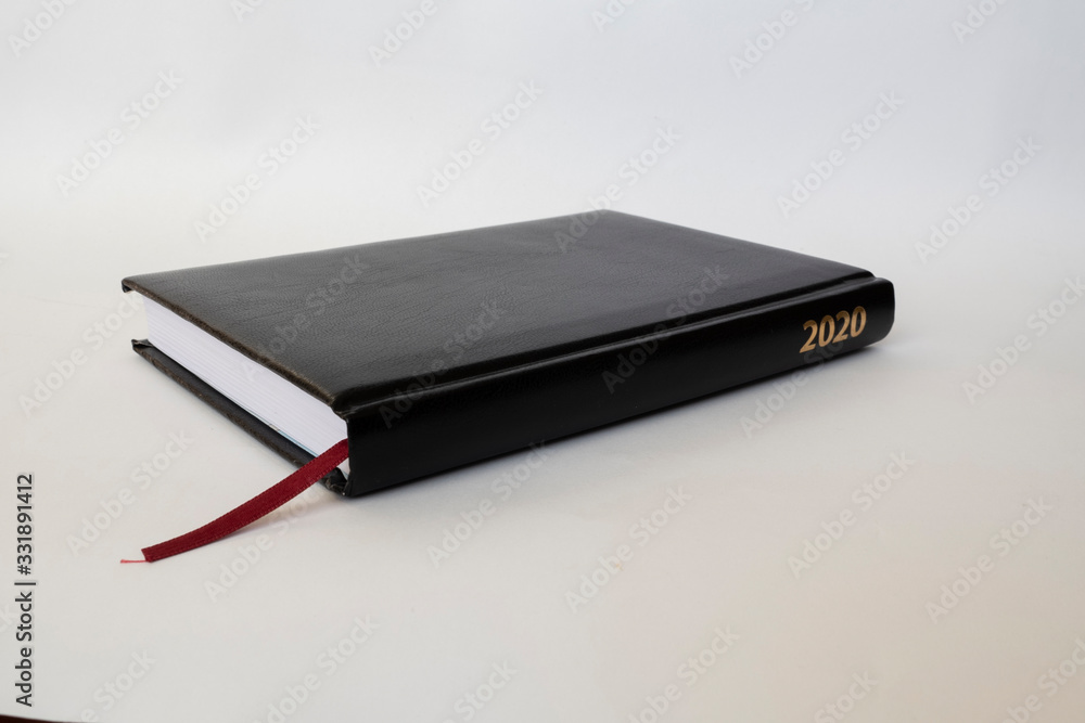 Black leather notebook on white background Black leather notebook on white background