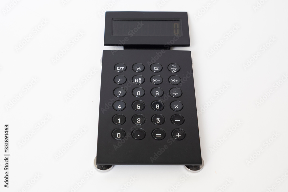 black modern calculator on a white background black modern calculator on a white background