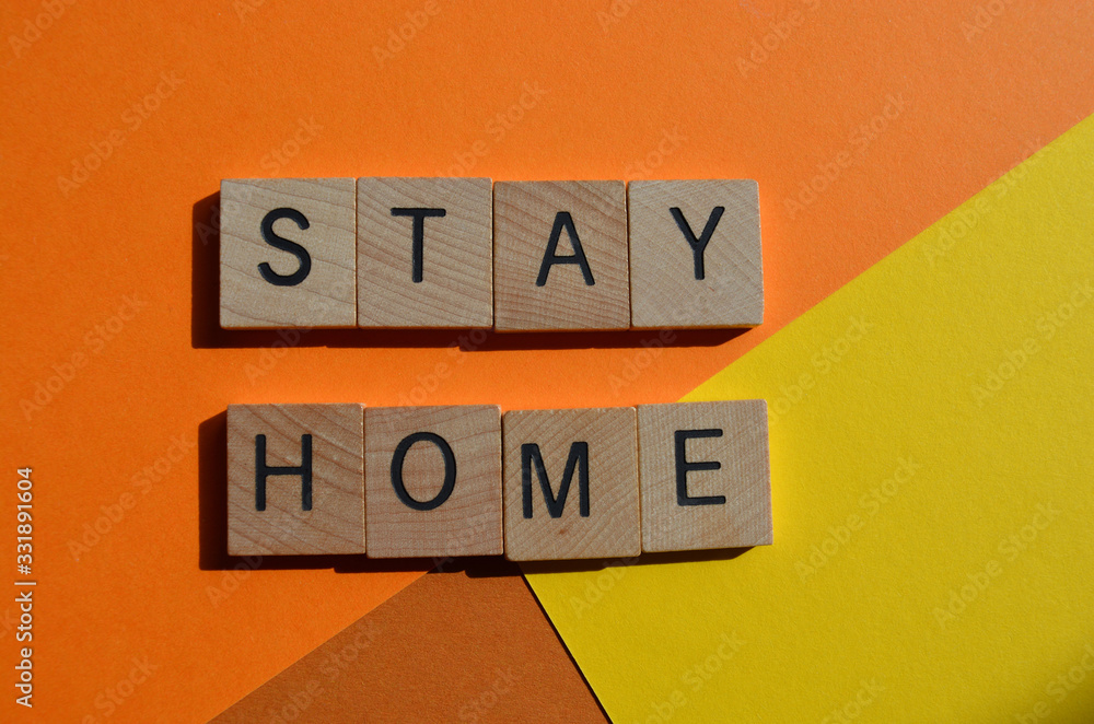 Stay Home, in 3d wood alphabet letters Stay Home, in 3d wood alphabet letters