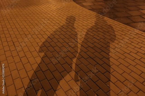  evening shadow of two people