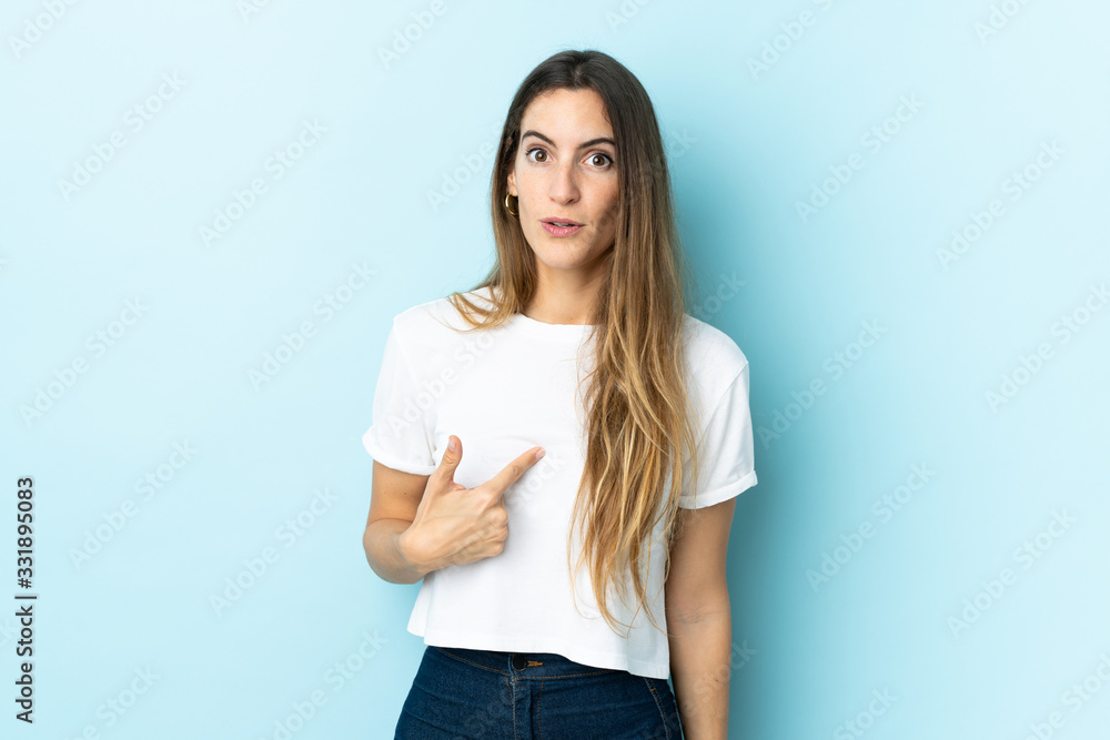 Young caucasian woman over isolated background pointing to oneself Young caucasian woman over isolated background pointing to oneself