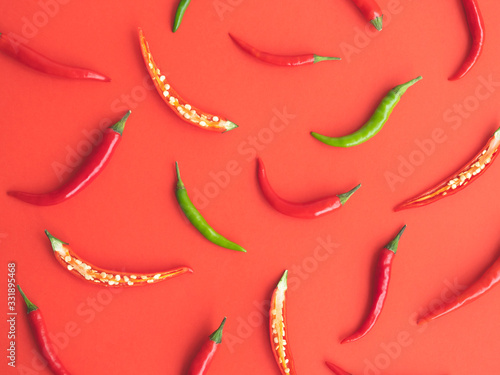 Chili peppers on a red background.