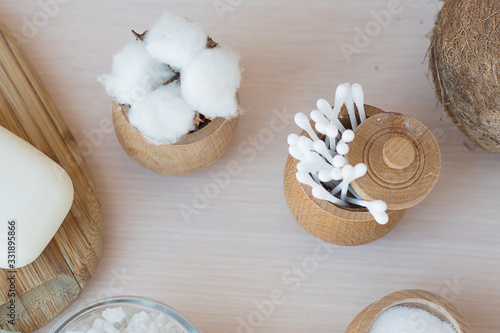  natural antisepti concept with spa setting. composition with Dead sea salt, coconut,  natural cosmetic blue clay,  soda, loofah. Flat lay, Spa concept with cotton flower, stones and towel. Copy space