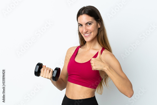 Sport woman making weightlifting isolated on white background with thumbs up because something good has happened