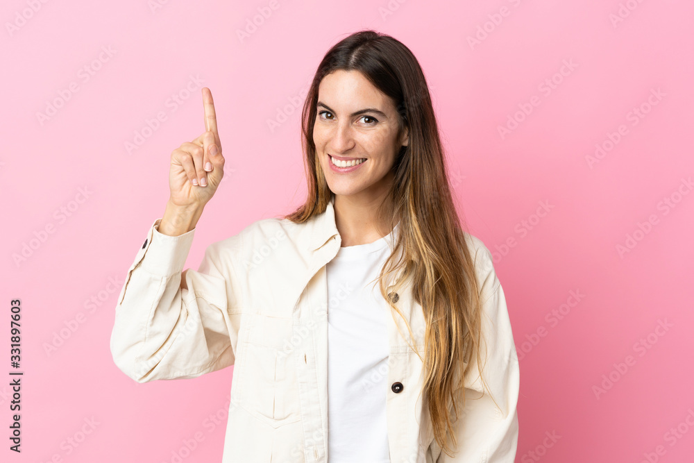 Young caucasian woman isolated on pink background pointing up a great idea Young caucasian woman isolated on pink background pointing up a great idea