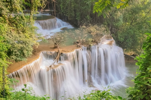 Beautiful soft silky water flowing on cliff rock with green forest background  Huanchanaburi  west of Thailand.y Mae Khamin Waterfall floor 4th  Chat Kaew  Ka