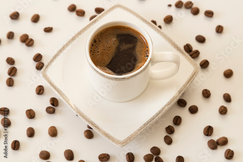 A cup of coffee bean concept on the white background.