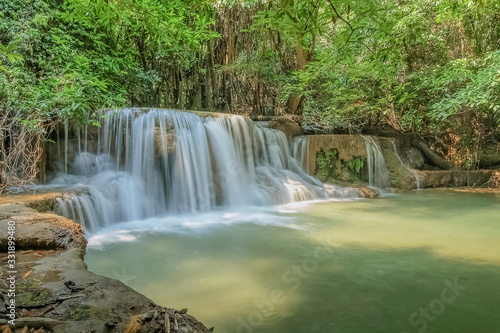 view of white silky water flowing around with green forest background  Huay Mae Khamin Waterfall floor 3th  Wang Nar Pha  Kanchanaburi  west of Thailand.