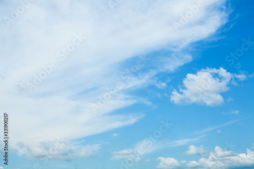 Fototapeta Naklejka Na Ścianę i Meble -  Blue sky clouds background. Beautiful landscape with clouds and orange sun on sky