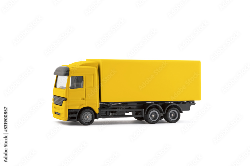 Yellow cargo delivery truck miniature isolated on white background with clipping path Yellow cargo delivery truck miniature isolated on white background with clipping path