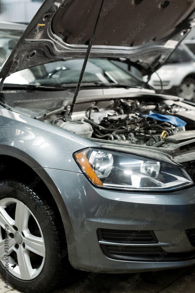 Hand mechanic in repairing car,Change the Oil.Car maintenance, concept. Middle shoot