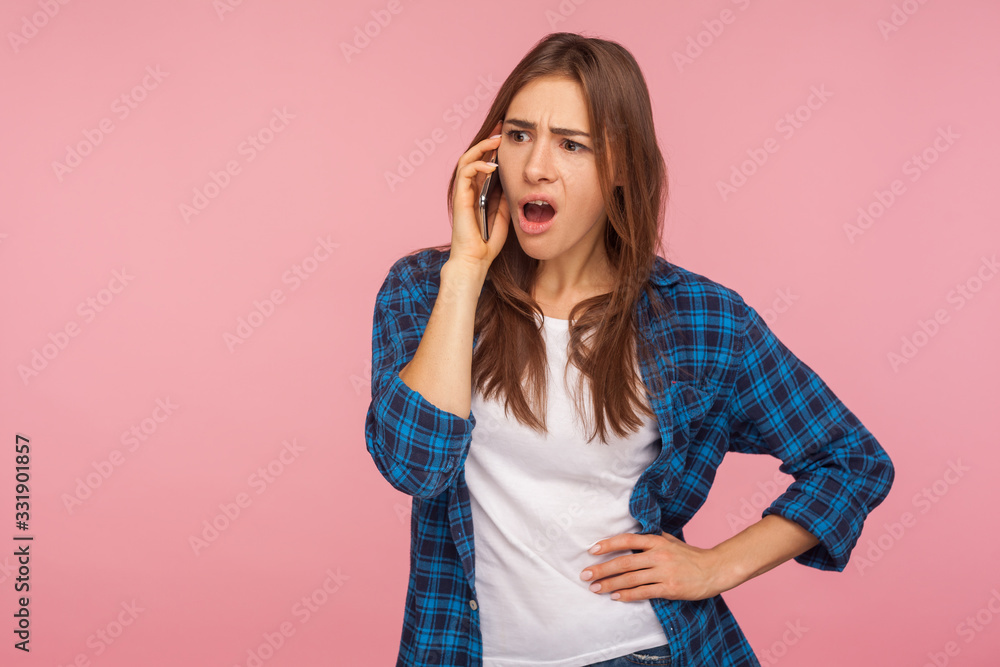 Resentful upset astonished girl calling to friend complaining about life with vexed expression, telling bad shocking news using cellphone, negative emotions. studio shot isolated on pink background Resentful upset astonished girl calling to friend complaining about life with vexed expression, telling bad shocking news using cellphone, negative emotions. studio shot isolated on pink background