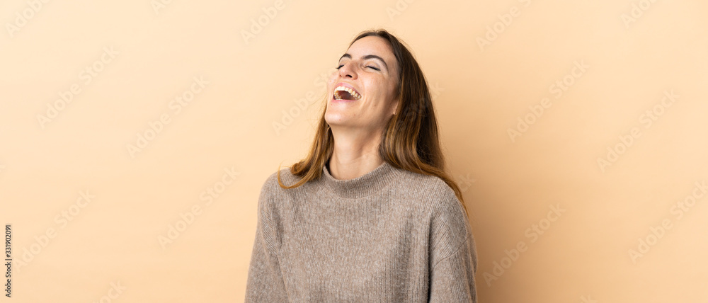 Young caucasian woman over isolated background laughing Young caucasian woman over isolated background laughing