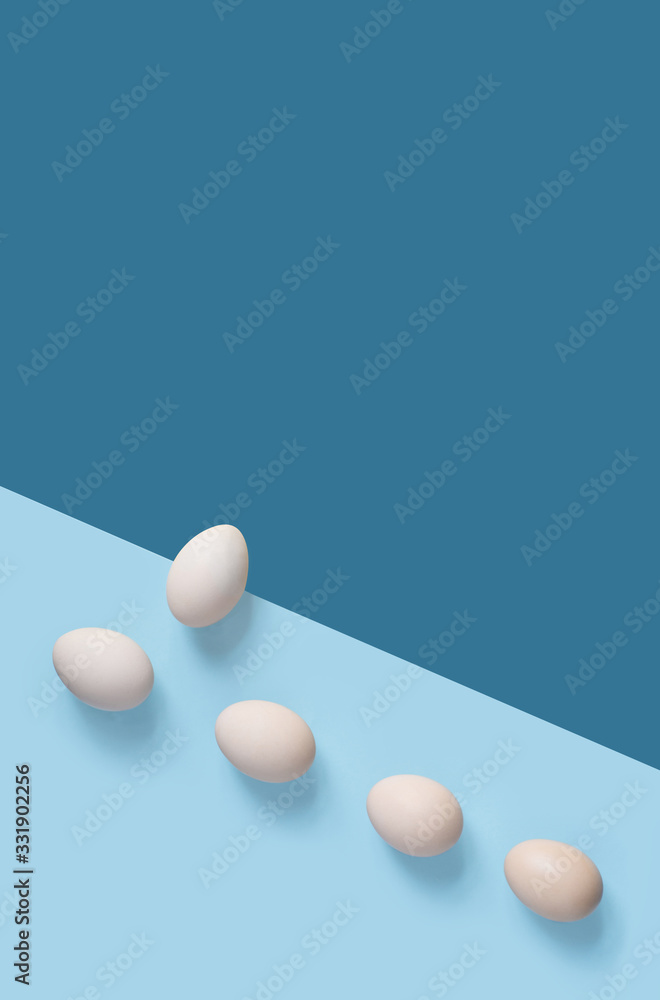 5 brown eggs on the flat background with geometric arragngment 5 brown eggs on the flat background with geometric arragngment
