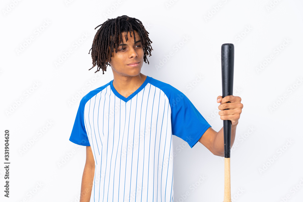 Young African American man playing baseball over isolated white background playing baseball Young African American man playing baseball over isolated white background playing baseball