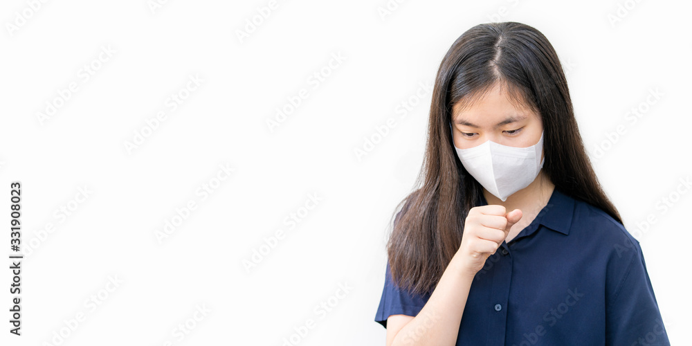 Young Asian woman coughing while wearing N95 mask Young Asian woman coughing while wearing N95 mask