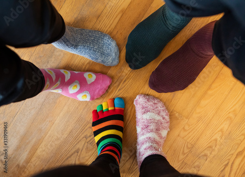 Funny family legs in mismatched socks photo