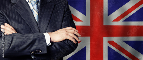 Wallpaper Mural Businessman in a suit with his hands arms crossed on flag background Torontodigital.ca