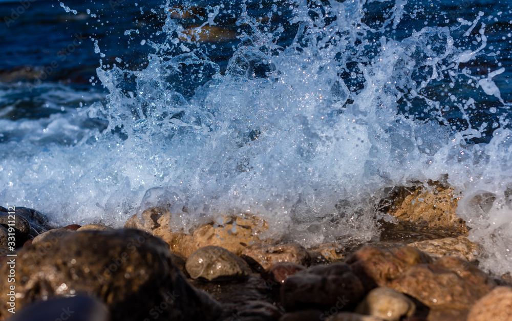 splashing water on the seashore of the mallorca island, giving a moment of relaxation, tranquility and calmness splashing water on the seashore of the mallorca island, giving a moment of relaxation, tranquility and calmness