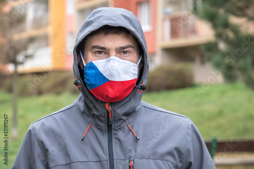 Man in face mask with flag of Czech Republic © andriano_cz