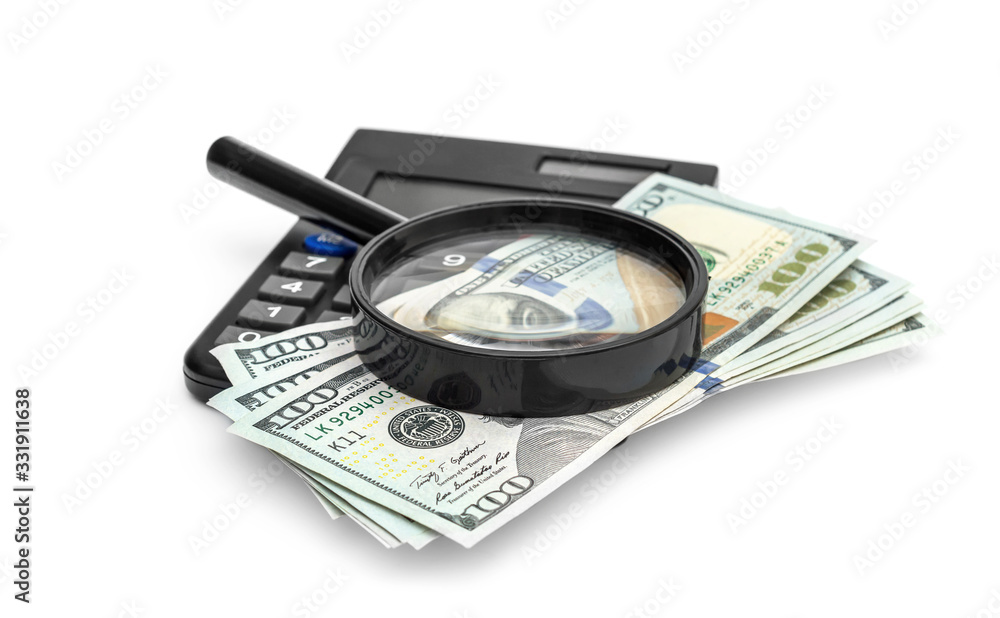 Calculator with money and magnifying glass on white. Calculator with money and magnifying glass on white.