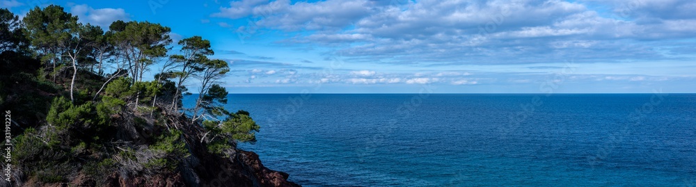 looking into the wide open ocean of the mediteranen sea on the island of mallorca during a wonderful sunny day with a beautful blue sky 