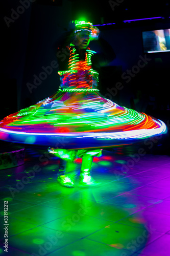 Dance of the Egyptian dervishes Tanura show. Light texture, blur background for design. photo