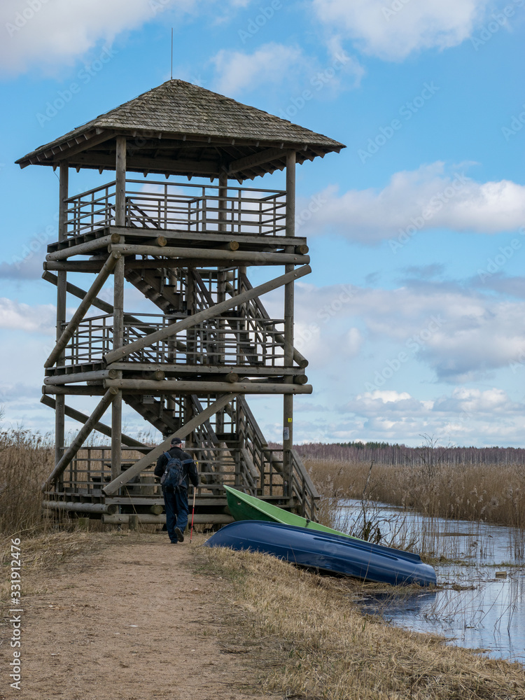 landscape with dirt road and bird watching tower landscape with dirt road and bird watching tower