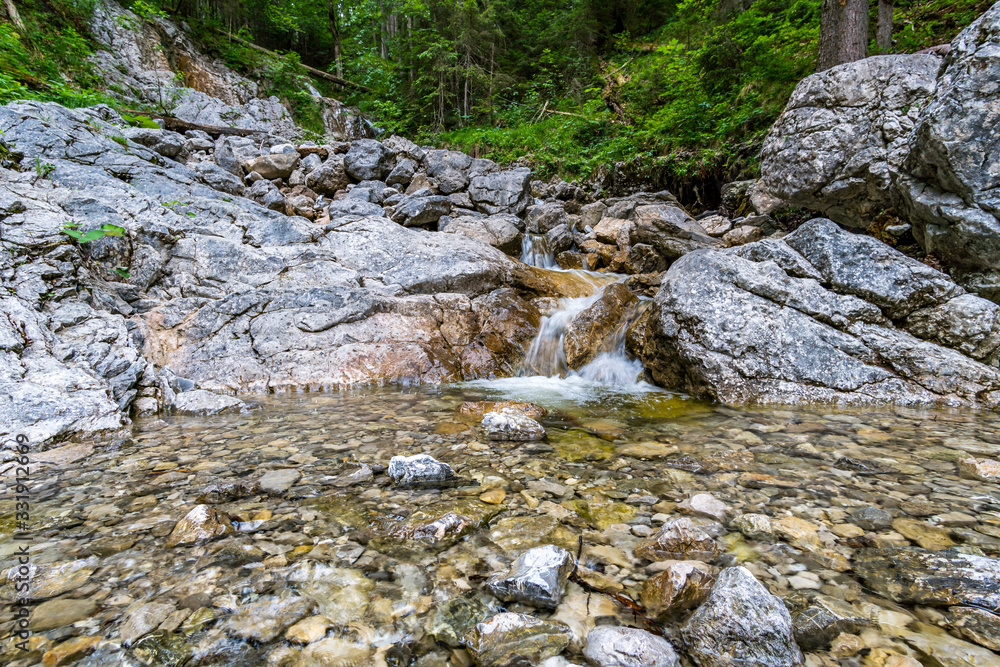Beautiful streams and small waterfalls on the Eibsee at the Zugspitze Beautiful streams and small waterfalls on the Eibsee at the Zugspitze
