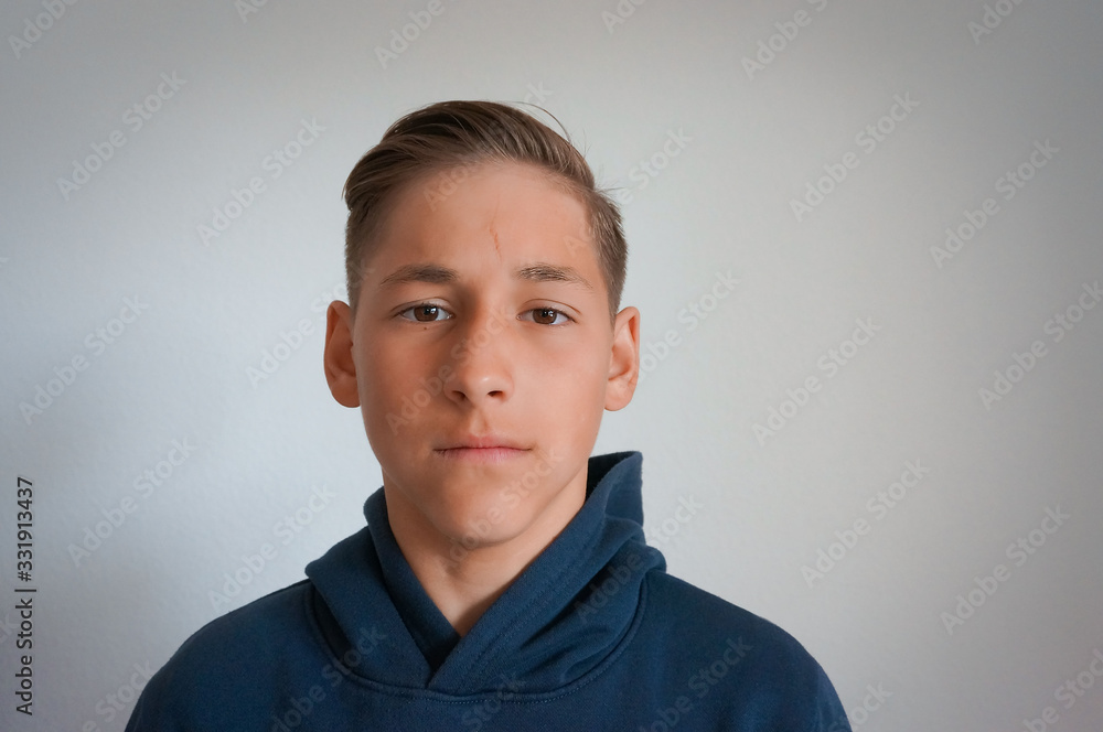 Teenager boy portrait looking to camera sad emotions Teenager boy portrait looking to camera sad emotions
