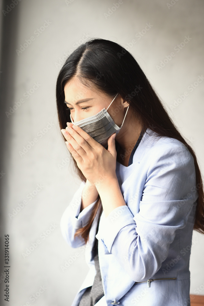Asian woman wear face mask, coughing with wear mask for virus protection, corona virus,covid-19 virus pandemic concept Asian woman wear face mask, coughing with wear mask for virus protection, corona virus,covid-19 virus pandemic concept