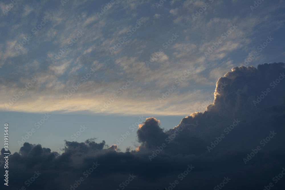 Storm clouds with blue sky background. Cloudscape in evening.