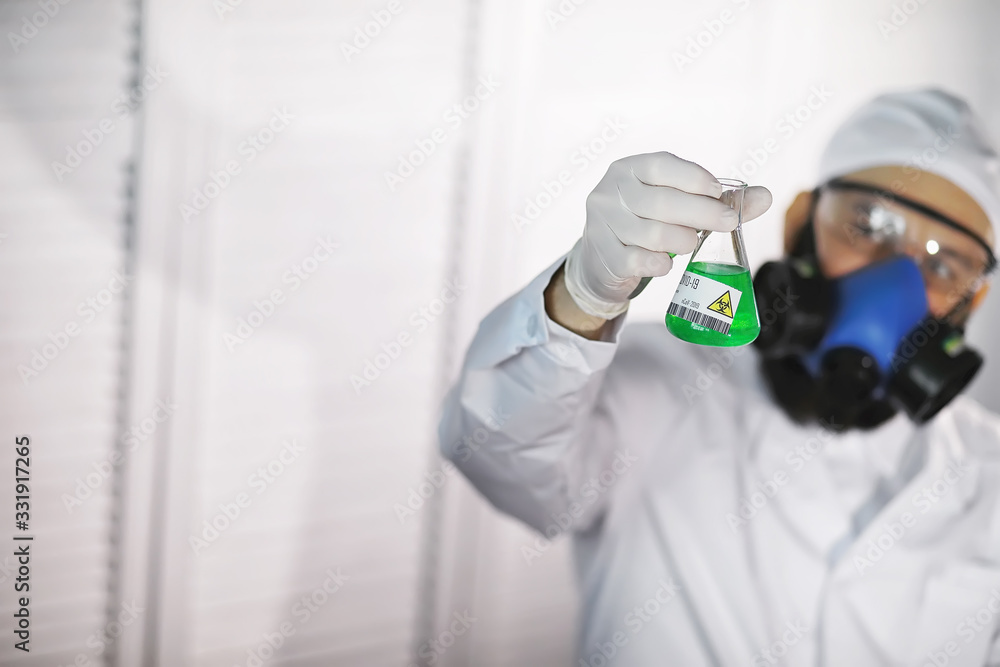 Naklejka premium A scientist researcher in the laboratory is testing drugs for the treatment of viral pneumonia. Coronovirus blood test of infected patients. World pandemic.