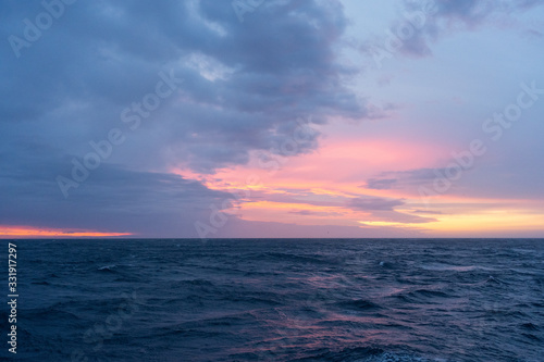 Colorful sunrise on the Drake Passage in the ocean