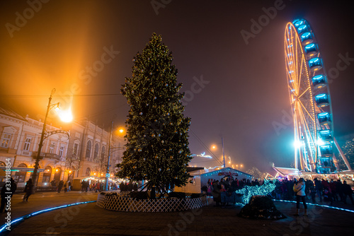 Christmas fair and ferris wheel at night in Debrecen