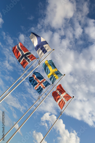Scandinavian flags towards blue sky